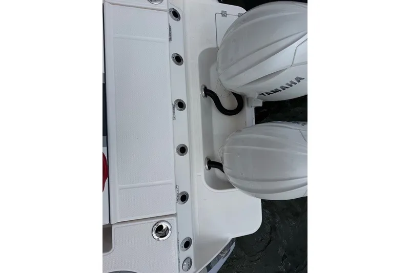 Slide: The Image of 2026 Robalo R270 Center Console boat with dual Yamaha engines. - 41