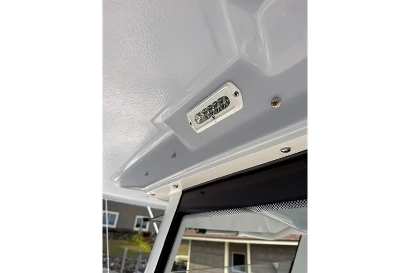 Slide: The Image of 2026 Robalo R270 Center Console boat interior ceiling light detail. - 37