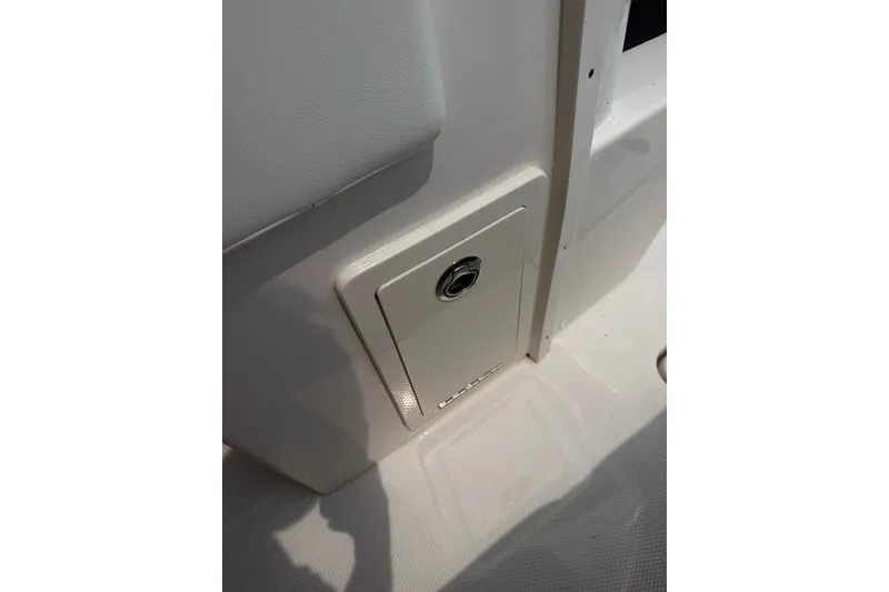 Slide: The Image of 2026 Robalo R270 Center Console boat storage compartment detail. - 46
