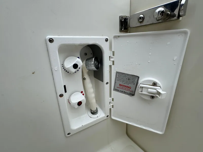 Slide: The Image of Hydra-Sports 3500 VX 2010 boat shower with control knobs. - 27
