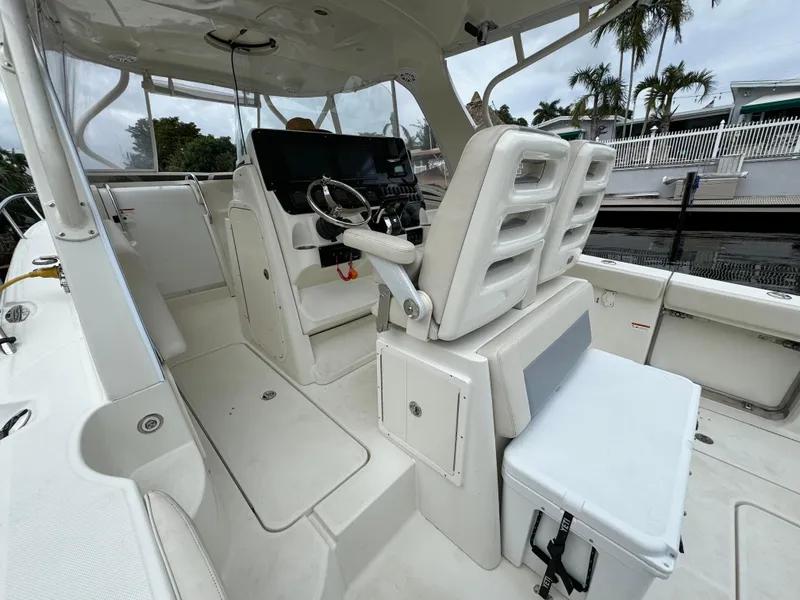 Slide: The Image of Interior of a 2010 Hydra-Sports 3500 VX boat with helm station. - 49