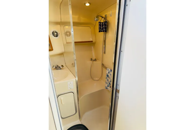 Slide: The Image of Bathroom interior of 1995 Sea Ray Sundancer 370 yacht, featuring shower and sink. - 18
