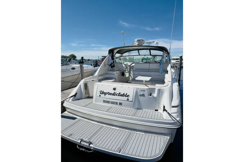 Slide: The Image of 1995 Sea Ray Sundancer 370 docked, rear view with "Unpredictable" nameplate, Grand Haven, MI. - 2