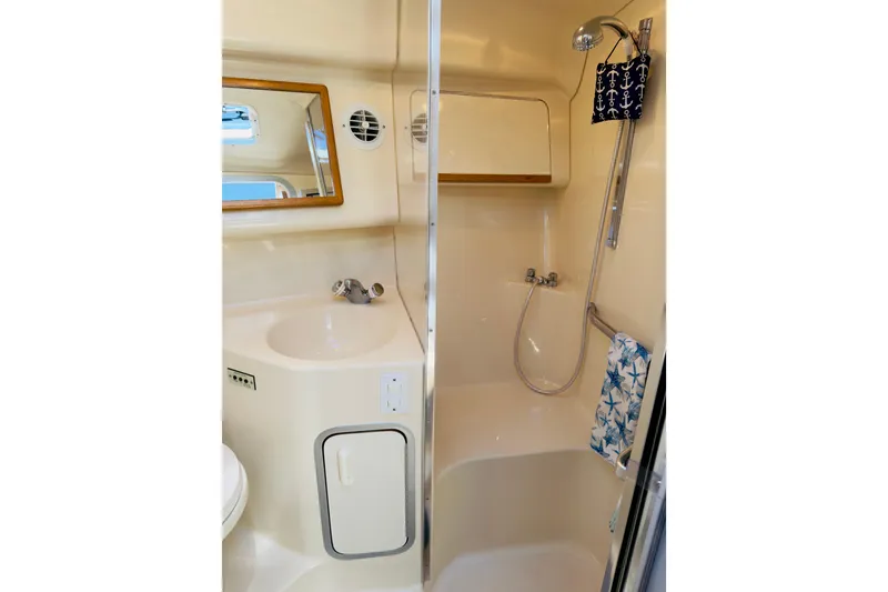 Slide: The Image of Bathroom interior of 1995 Sea Ray Sundancer 370 yacht, featuring shower and sink. - 20