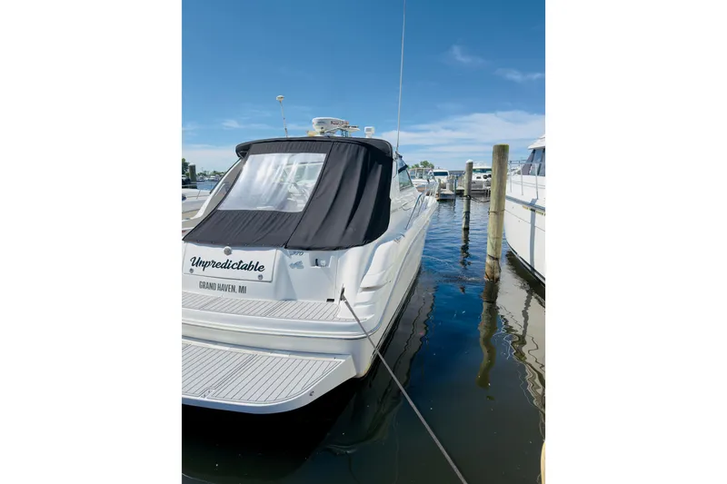 Slide: The Image of 1995 Sea Ray Sundancer 370 docked at marina, rear view with cover. - 22