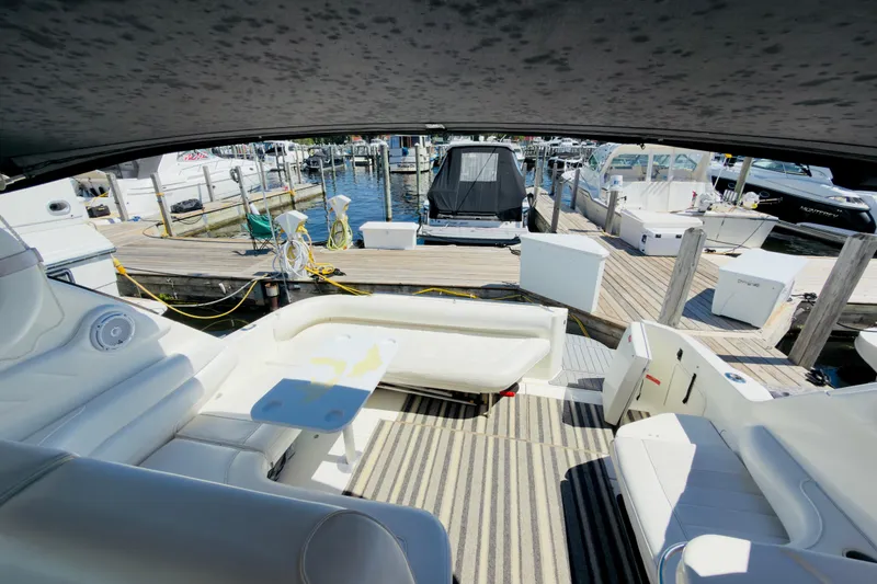 Slide: The Image of Interior view of a 1995 Sea Ray Sundancer 370 yacht docked at a marina. - 6