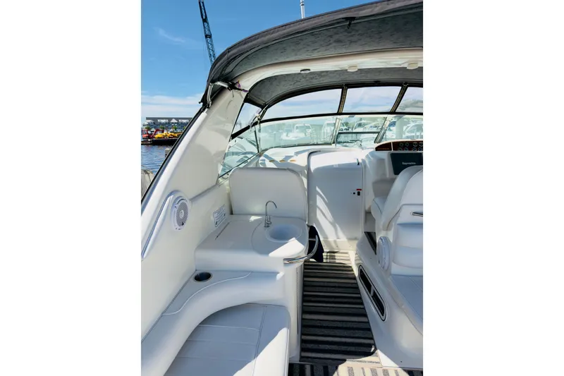 Slide: The Image of Interior view of a 1995 Sea Ray Sundancer 370 yacht, featuring seating and helm area. - 8