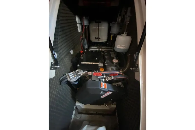 Slide: The Image of Engine compartment of a 2015 Salona 44 yacht, showcasing mechanical components. - 5