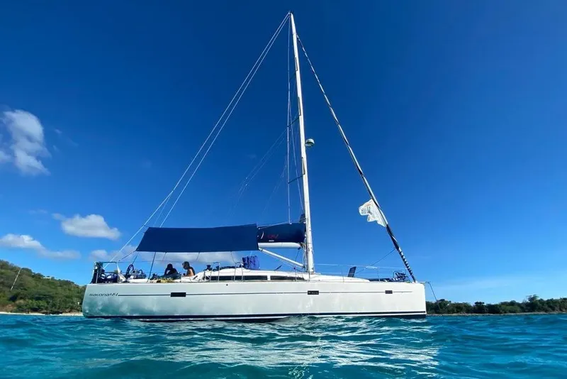Slide: The Image of 2015 Salona 44 sailboat on clear blue water under a bright sky. - 16