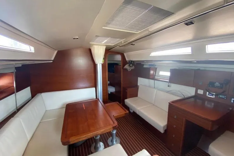 Slide: The Image of Luxurious interior of 2015 Salona 44 yacht with elegant wood and white seating. - 15