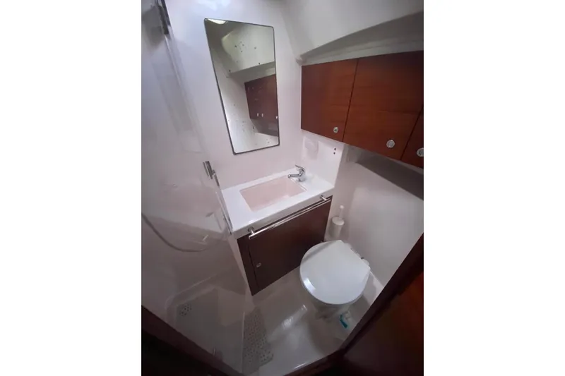 Slide: The Image of Bathroom interior of 2015 Salona 44 yacht with modern fixtures and wooden cabinetry. - 12