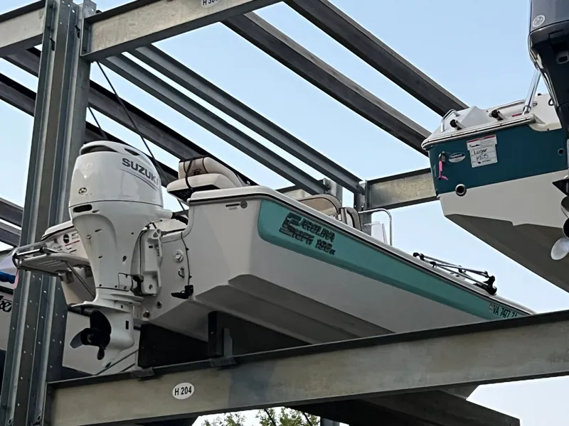 The Image of Carolina Skiff 192 CC 2020 on boat rack with Suzuki engine. - 0