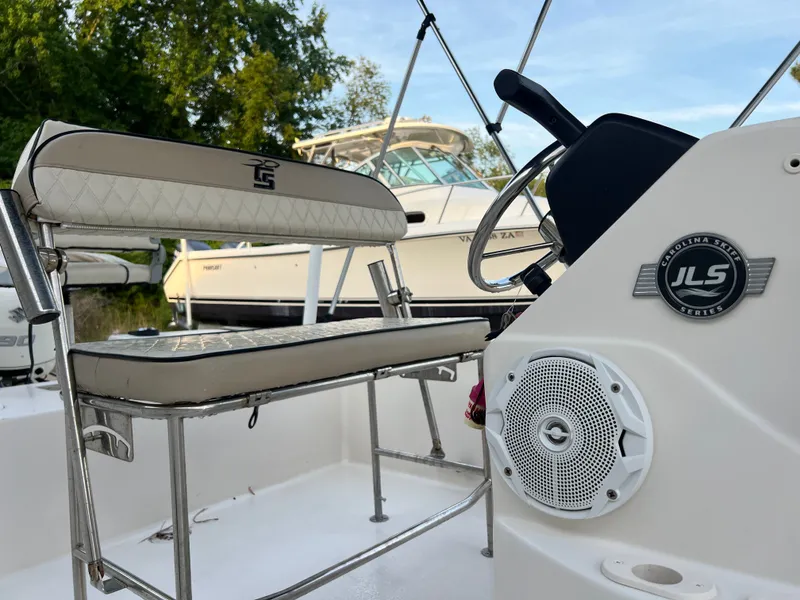 Slide: The Image of Close-up of a boat console with a bench seat and speaker. - 6