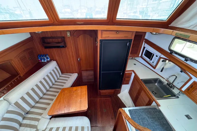 Slide: The Image of Interior of 1987 Fair Weather Mariner 38 yacht with kitchen and seating area. - 20