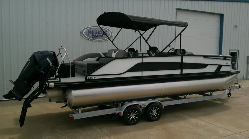 Slide: The Image of Evotti 525 CS pontoon boat 2026 on trailer outside warehouse. - 4