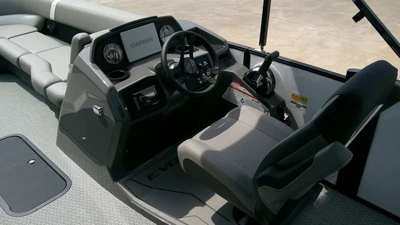 Slide: The Image of Interior of Evotti 525 CS boat, 2026 model, featuring Garmin controls. - 9