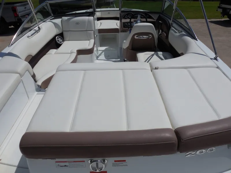 Slide: The Image of Interior of a 2011 Cobalt 200 boat with white seating. - 14