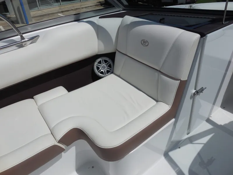 Slide: The Image of Interior of a 2011 Cobalt 200 boat with beige upholstered seating. - 18