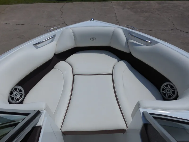 Slide: The Image of Interior of a 2011 Cobalt 200 boat with white upholstery. - 19