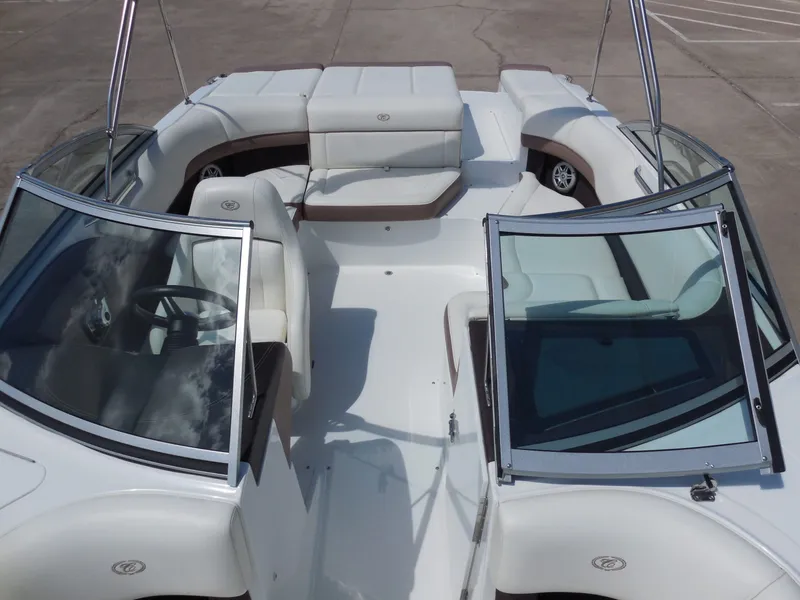 Slide: The Image of Interior view of a 2011 Cobalt 200 boat on a parking lot. - 21