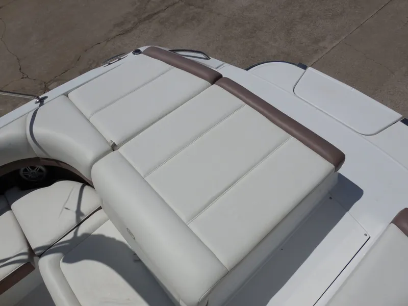 Slide: The Image of 2011 Cobalt 200 boat with white cushioned deck. - 27