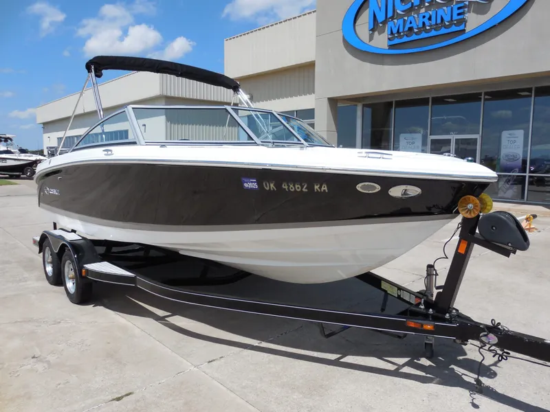 Slide: The Image of 2011 Cobalt 200 boat on trailer outside a building. - 3