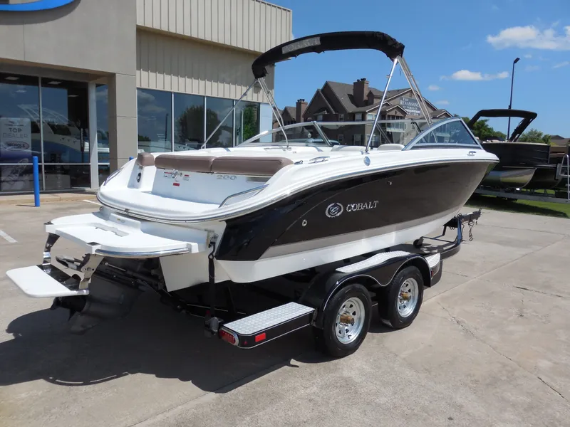 Slide: The Image of 2011 Cobalt 200 boat on trailer outside a building. - 4