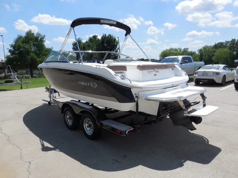 Slide: The Image of 2011 Cobalt 200 boat on trailer parked outdoors. - 6
