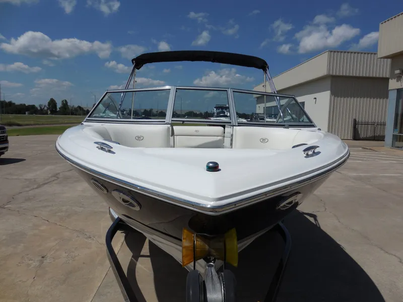 Slide: The Image of 2011 Cobalt 200 boat on trailer, blue sky background. - 9