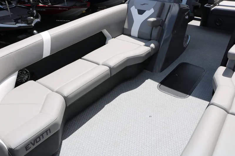 Slide: The Image of Interior of 2026 Evotti 525 CS Tri Toon with gray seating. - 27