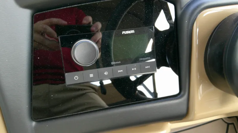 Slide: The Image of Evotti 725 QL 2026 dashboard with Fusion Bluetooth control. - 14