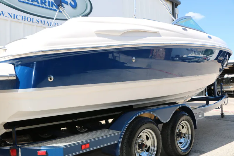Slide: The Image of 2005 Chaparral 220 SSi boat on trailer, blue and white. - 12
