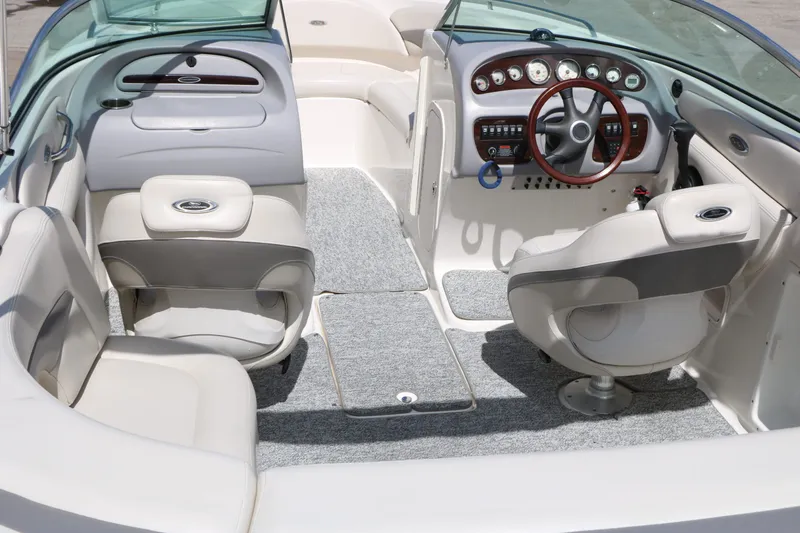 Slide: The Image of Interior of a 2005 Chaparral 220 SSi boat with steering wheel and seats. - 19
