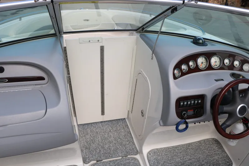 Slide: The Image of Interior view of a 2005 Chaparral 220 SSi boat dashboard. - 31