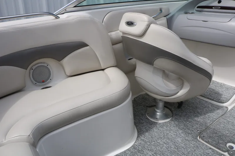 Slide: The Image of Interior of a 2005 Chaparral 220 SSi boat with beige seating. - 44
