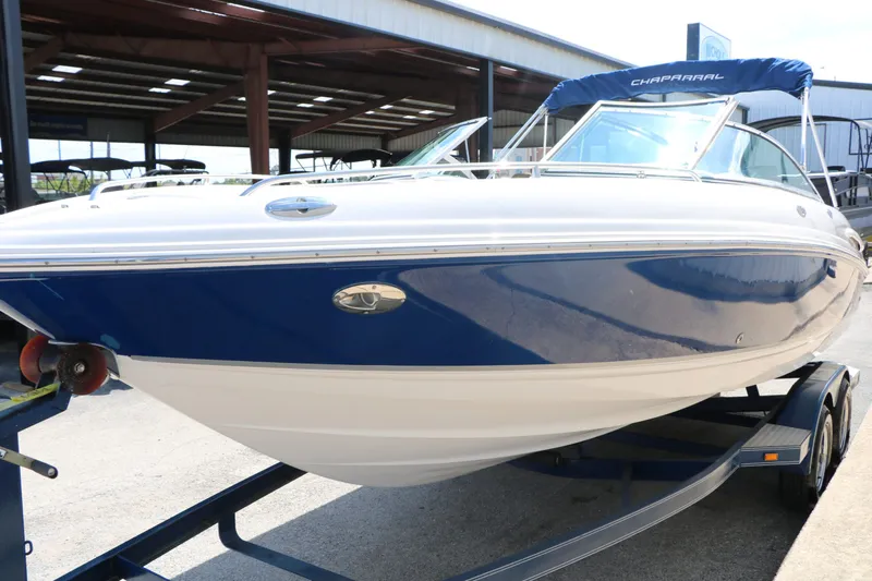 Slide: The Image of 2005 Chaparral 220 SSi boat on trailer in warehouse. - 7