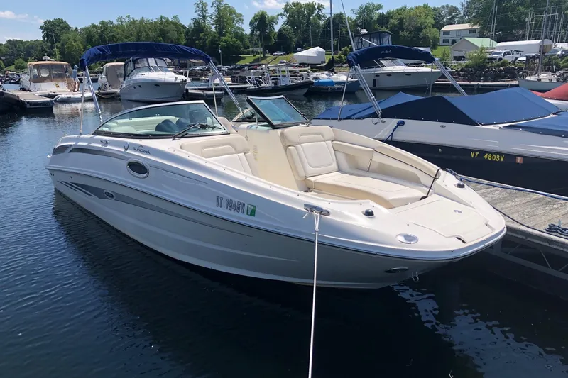 The Image of 2013 Sea Ray 260 Sundeck boat docked at a marina on a sunny day. - 0