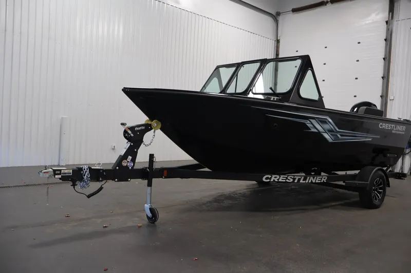 Slide: The Image of 2026 Crestliner 1850 Commander boat on trailer in indoor setting. - 35