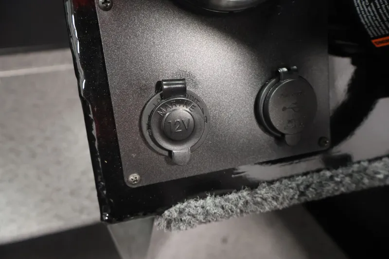 Slide: The Image of 12V marine power outlets on 2026 Crestliner 1850 Commander boat. - 16