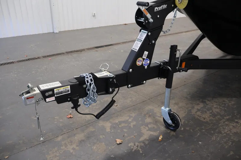 Slide: The Image of Trailer hitch of 2026 Crestliner 1850 Commander boat with safety chains and wheel jack. - 34