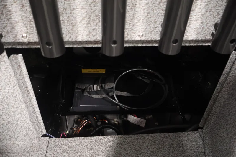 Slide: The Image of Storage compartment of 2026 Crestliner 1850 Commander boat with cables and equipment. - 30