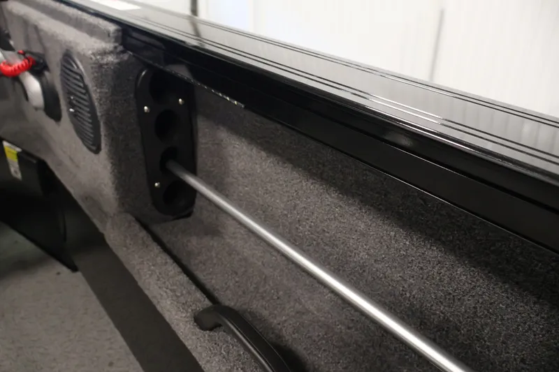 Slide: The Image of Interior view of 2026 Crestliner 1850 Commander boat, featuring rod storage and speaker. - 28