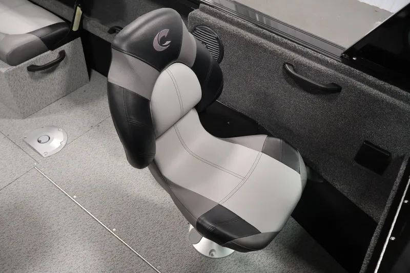 Slide: The Image of 2026 Crestliner 1850 Commander boat seat, gray and black design, interior view. - 20