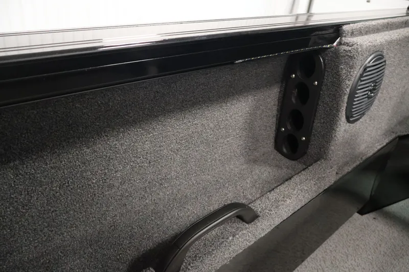 Slide: The Image of Interior of 2026 Crestliner 1850 Commander boat with speaker and rod holders. - 27