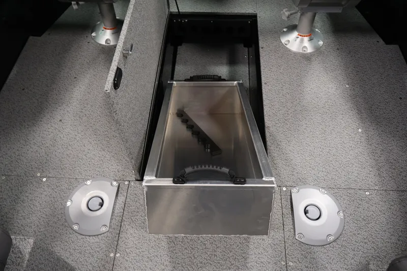Slide: The Image of Interior view of 2026 Crestliner 1850 Commander boat with open storage compartment. - 23