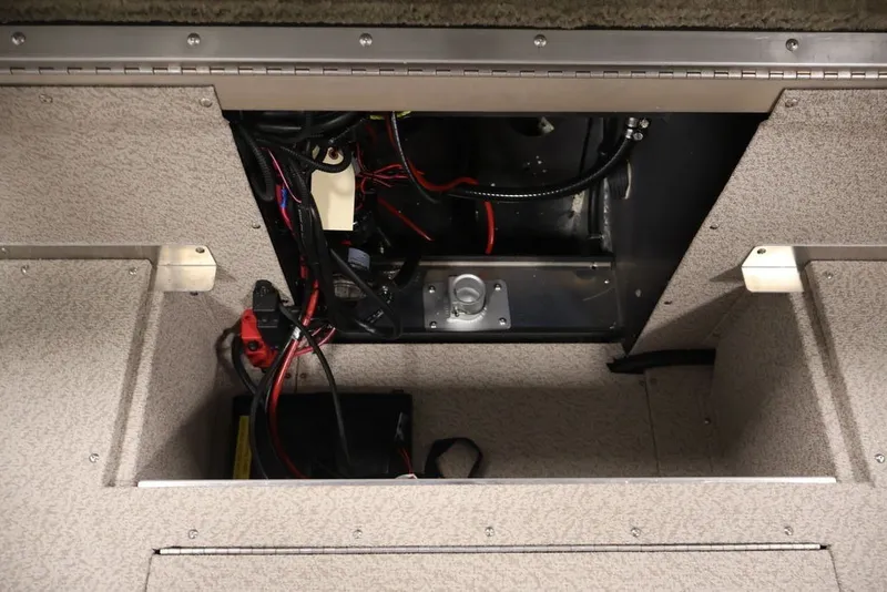 Slide: The Image of 2026 Crestliner 2050 Sportfish boat interior wiring and battery compartment. - 31