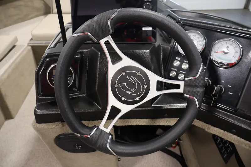 Slide: The Image of Steering wheel and dashboard of 2026 Crestliner 2050 Sportfish boat, featuring modern gauges. - 18
