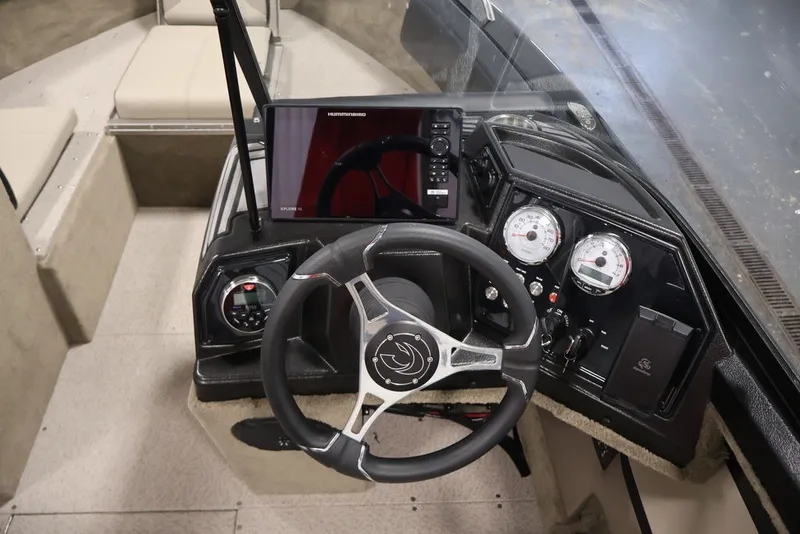 Slide: The Image of Interior view of 2026 Crestliner 2050 Sportfish boat dashboard with steering wheel and gauges. - 26