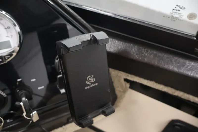 Slide: The Image of Dashboard of 2026 Crestliner 2050 Sportfish with phone holder and gauge. - 27