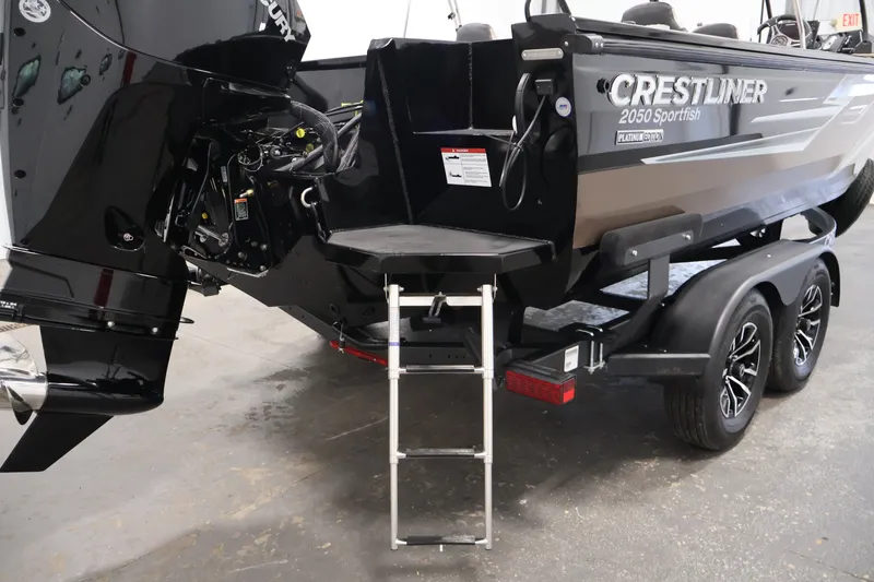 Slide: The Image of 2026 Crestliner 2050 Sportfish boat with ladder and Mercury engine on trailer. - 34